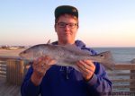 Ben Rollason, of Kill Devil Hills, with a 21" puppy drum that he hooked while fishing from Jennette's Pier.