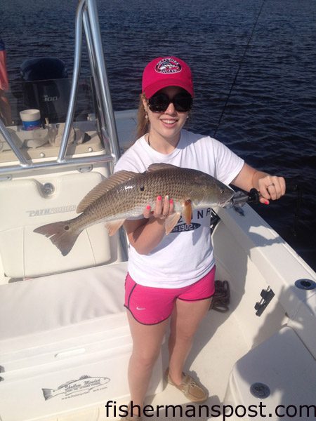 Kate Thomas, from GA, with a red drum that struck a chunk of blue crab in the Sunset Beach bridge canal while she was fishing with Capt. Mark Dickson of Shallow Minded Inshore Fishing Charters.
