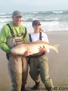 Lance and Ashley Brown, of Charlotte, with a 42" red drum Ashley caught and released after it struck a cut bait at Cape Point. Photo courtesy of Frank and Fran's Bait and Tackle.