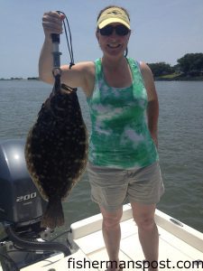 Allison Wilkins, of Bolivia, NC, with a 6.25 lb. flounder that bit a live menhaden in the Shallotte River.