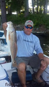 Joe Kohutek, of Newport, NC, with a 28" red drum that struck a Bill Norman shrimp imitation in Queens Creek.