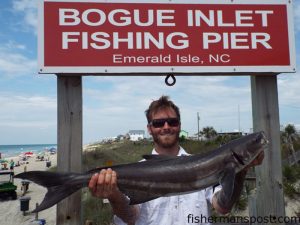Josh Bachand, of Peletier, NC, with a 13 lb., 4 oz. cobia that bit a gold/red Gotcha plug he was working off Bogue Inlet Pier.