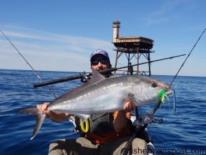 Matt Anderson, of Suffolk, VA, with an amberjack he hooked on a Spro bucktail  with a soft plastic trailer near Diamond Shoals Tower while he was fishing on a mothership trip with Rob Alderman of Outer Banks Kayak Fishing.