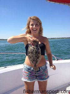 Halye Lohr, of Graham, NC, with a 16" flounder she hooked near New Topsail Inlet while fishing with her cousins on the "FlatFish."