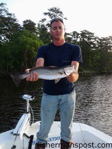 Mike Sachs with a speckled trout that bit a Zoom soft plastic under a popping cork in Slocum Creek while he was fishing with Capt. Stukie Payne of Carolina Backwater Charters.