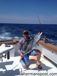 John King, of Charlotte, with a yellowfin tuna that struck a skirted ballyhoo along a weedline off Oregon Inlet while he was fishing with Keith and Guy Baer aboard the "Sandra D."