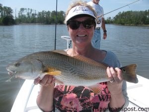 Kathy Cleland, of Belford, TX, with an upper-slot red drum that bit a D.O.A. Deadly Combo rig in the Neuse River while fishing with Capt. Gary Dubiel of Spec Fever Guide Service.
