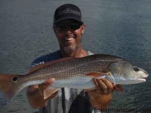 Gary Hurley with a solo topwater red drum caught on an oyster bar in Buzzards Bay during a morning exploration run with Mark Johnson.