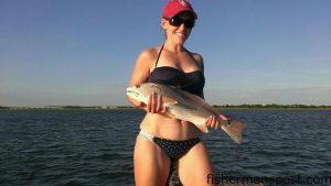 Vanessa Smith, of Richlands, NC, with a 25.75" red drum that bit a live finger mullet on a Carolina rig while she was fishing a Swansboro-area marsh.