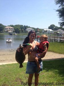Tilden and Camden (age 3) Barlow with Camden's first fish, a 20" flounder he caught in the ICW at Oak Island.