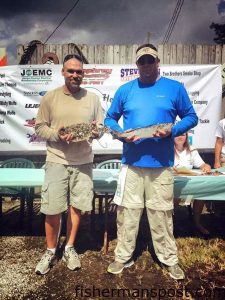 Walter Giese and Stephen Nelson with the 2.09 lb. flounder and 2.25 lb. speckled trout that they paired with a 4.55 lb. red drum to capture the $1000 top prize in the Reeling to Heal Inshore Slam, held July 26 out of the Marina Cafe in Jacksonville.