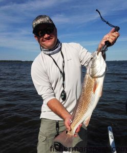 Mike Fujimagari, of New Bern, with an upper-slot red drum that struck a D.O.A. soft plastic in the Bay River while he was fishing with Capt. Dave Stewart of Knee Deep Custom Charters.