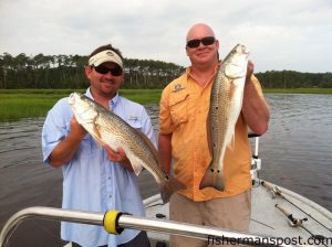 Daniel Griffee and Ben Ricks with a pair of red drum that bit a Bomber Badonka Donk topwater plug and a Redfish Magic spinnerbait in the Haystacks marsh.