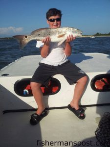 Storm Cline, of TN, with a 29" red drum he caught and released near Carolina Beach while fishing with Capt. Charlie Schoonmaker of Back Bay Fishing Charters.