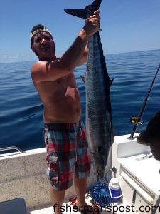 Craig Henshall, of New Bern, with a 28 lb. wahoo he hooked 20 miles off New River Inlet while fishing with Guy Pepper on the "Minnow."