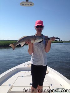 Erica Hyde, from Atlanta, with a red drum that struck a finger mullet while she was fishing in Bonaparte Creek with Capt. Mark Dickson of Shallow Minded Inshore Fishing Charters.