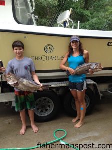 Drew Maynor and Samantha Stephens with a pair of scamp grouper they hooked on cigar minnows while fishing southwest of Frying Pan Tower in 80' of water with Chris Maynor on the "Knot-A-Clue."