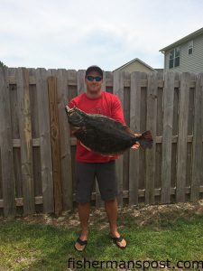 Gage Gattone, of Rocky Point, NC, with an 11.3 lb., 30" flounder that bit a Gulp bait in the Cape Fear River while he was fishing aboard the "Flounder Express."