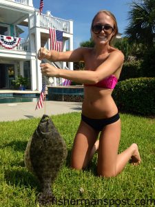 Caroline Ciener, of Wrightsville Beach, with a 21" flounder that struck a live mud minnow off her dock at the north end of the island.