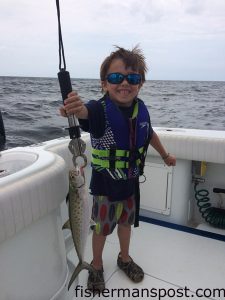 Christian Cook (age 5) with a spanish mackerel that struck a Clarkspoon behind a planer in 25' of water off Holden Beach while he was fishing on the "Pokey."