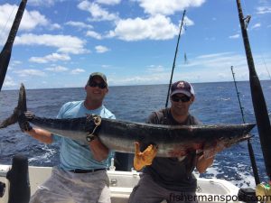 Neal O'Neal and Brian Fischer with a 92 lb. wahoo that struck a large ballyhoo behind a #16 planer near the Big Rock while they were trolling on the "Pillpusher" out of Salter Path.