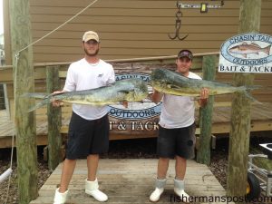 Jordan Delatch and Marc Bankoski, of Goldsboro with a pair of 22 lb. dolphin they hooked on ballyhoo near the 14 Buoy. Weighed in at Chasin' Tails Outdoors.