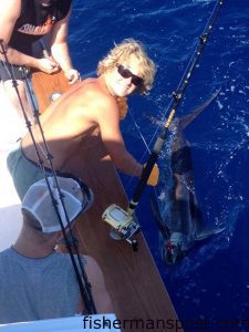 Mate Alastar prepares to release a blue marlin fought by angler Nick Nanovic, of Allentown, PA, off Hatteras Inlet. They were trolling aboard the "Capt. Snag" with Capt. Jeremy Hicks.