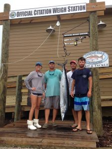 Stephanie Milich, Wayne Garrell, Winston Bland, David Paul Edwards with a 65 lb. wahoo that struck a trolled ballyhoo near the Big Rock. Weighed in at Chasin' Tails Outdoors.