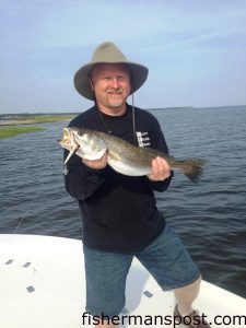 Gerald Benton, of Snow Hill, NC, with his first topwater speckled trout, a 23.5" fish that bit a Storm Chug Bug in the Neuse River near Minnesott Beach while he was fishing with Capt. Dave Stewart of Knee Deep Custom Charters.