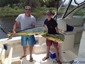 William and Hunter Ratcliff with two of eleven dolphin they caught 54 miles off Carolina Beach while fishing with Tony and Marty.