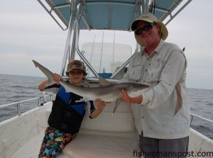 Capt. Robert Schoonmaker, of Carolina Explorer Charters, and James Hurley with another Atlantic sharpnose. Robert's estimate is that the shark is the same size as Owen's, but James thinks it measures a little longer than Owen's.