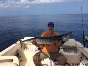 Ray Scott, of Chesapeake, VA with a wahoo that fell for a blue/white-skirted ballyhoo in 100' of water near Diamond Shoals Tower while he and his wife Linda were fishing on the "Ray-Lin."