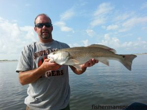 Jonathan Orrell, of Mocksville, NC, with a 28" red drum that bit a live finger mullet in the ICW near Ocean Isle.