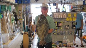 Sam Lloyd, of Frisco, NC, with a 5 lb. 5 oz. flounder he hooked in the Pamlico Sound. Weighed in at Teach's Lair Marina.