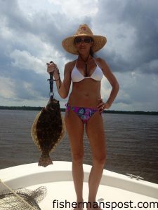 Deanna Matthews with a flounder that fell for a live menhaden in the Cape Fear River.