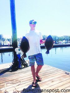 Kevin Darr, of Charlotte, NC, with a pair of 20" flounder that bit live finger mullet at some nearshore structure off Lockwood Folly Inlet while he was fishing with his father.