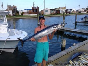 Zach Rouse, of Winterville, NC, with a wahoo that bit a skirted ballyhoo while he was trolling near the Rise.