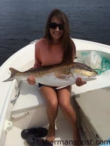 Brooke Chambers with a citation-class red drum that bit a chunk of mullet in the Pamlico Sound.