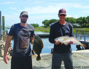 Brian McCloskey and Butch Davis--team "I'd Hit It"--with the flounder and winning 7.45 lb. red drum they weighed in at the Carolina Beach Inshore Challenge. Both bit mullet near a grass bank at Wrightsville Beach.