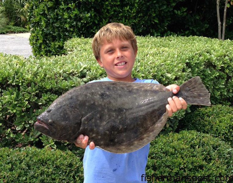 Web Eckel (age 9) with a 4+ lb. flounder he hooked on a live finger mullet off his dock at Wrightsville Beach.