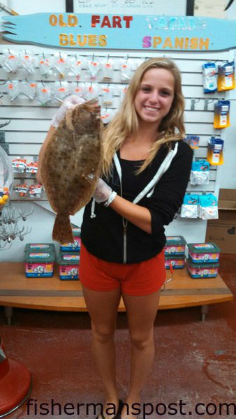 Samantha Ducharme, of Detroit, MI, with her first flounder, a 19″ fish that bit cut shrimp off Seaview Pier.