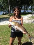 Teak Salmons with a 27" red drum that inhaled a live mud minnow while she was fishing from a Shalotte River dock.