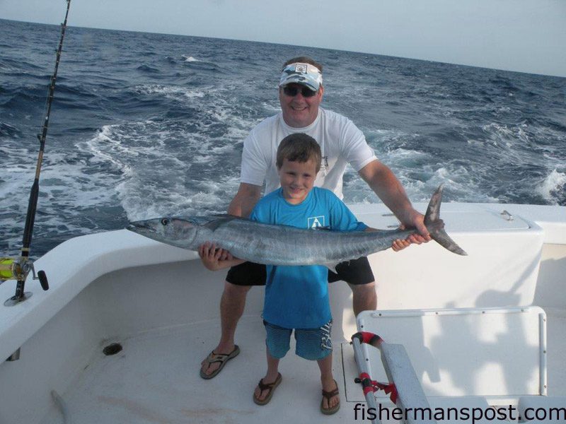 Ricahrd and Connor Mcinnis, of Rockingham, NC, with Connor’s first offshore fish, a wahoo that he landed while trolling offshore of Hatteras Inlet with on the “Hatteras Fever II” with Capt. Buddy Hooper.