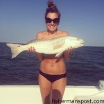 Jessica Dean, of Mount Pleasant, NC, with a red drum that struck a live finger mullet at some nearshore structure off Carolina Beach.