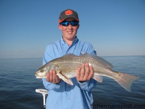 Garrison Peppers, of Raleigh, with an upper-slot red drum that struck a D.O.A. Deadly Combo rig while he was fishing the lower Neuse River with Capt. Gary Dubiel of Spec Fever Guide Service.