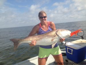 Heidi Griffee, of New Bern, caught and released this 52" red drum in the Pamlico Sound after it engulfed a chunk of mullet while she was fishing with Ben Ricks.