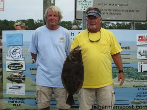 Marty Edwards and Kenneth Crisco topped the leaderboard at the Bay Creek Classic with this 7.25 lb. flounder. Crisco hooked the big flatfish while casting a large mullet to a deep hole in the Lockwood Folly River.