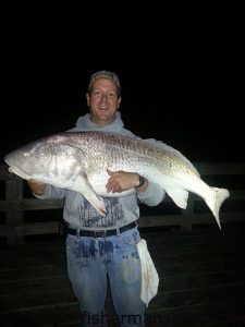 Michael Selby, of Ft. Valley, VA, with a 51" red drum he caught and released from Nags Head Pier after it fell for a chunk of mullet on the bottom.