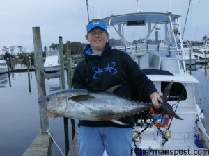 Jake Worthington, of Camden, NC, with a yellowfin tuna (one of 14 yellowfins and blackfins) he landed on a recent trip off Oregon Inlet aboard the "Swordfish."
