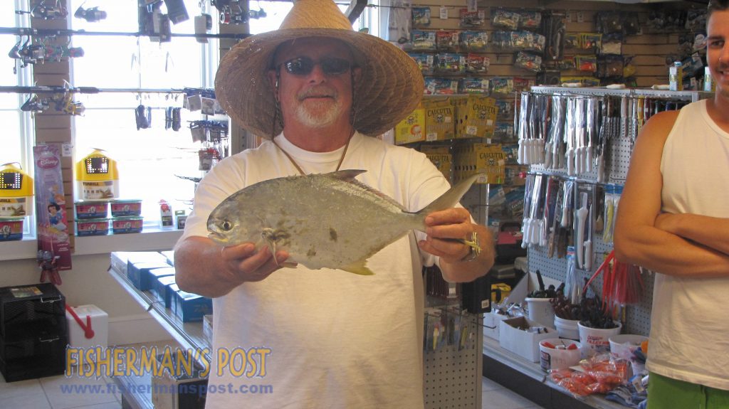 Glenn Jones, of Virginia Beach, with a 2 lb., 10 oz. pompano he hooked while surf fishing at Hatteras. Weighed in at Teach's Lair.